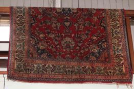 Eastern design rug with a red ground, 2.26 by 1.42.