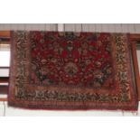 Eastern design rug with a red ground, 2.26 by 1.42.