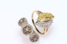 Two 9 carat gold, diamond and gem set ornate rings.