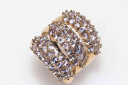 Three 9 carat gold multi-stone gem set rings.