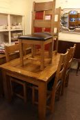 Rectangular oak extending dining table and six ladder back chairs together with a three door