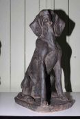 Composite seated dog statue, 55cm high.