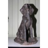 Composite seated dog statue, 55cm high.