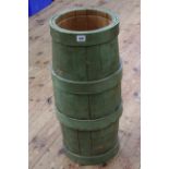 Green painted barrel stick stand, 67cm high by 28cm diameter.