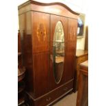 Early 20th Century inlaid mahogany oval mirror door wardrobe.