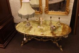 Oval onyx and gilt coffee table, onyx lamp, candle holders, etc.