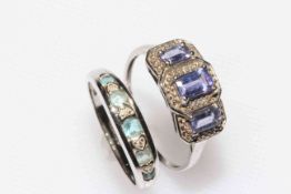 Two gem set white gold rings.