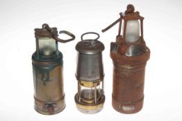 Three miners lamps including Oldham 900-4090.