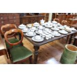 Late Victorian oak extending dining table, two leaves and winder raised on reeded legs,