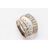 Two 9 carat gold and diamond set rings, one with fourteen stones in pairs,