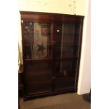 Mahogany glazed four door bookcase, 183cm high by 130cm wide by 33cm deep.