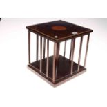 Inlaid mahogany table top revolving bookcase, 29cm high by 28cm by 28cm.