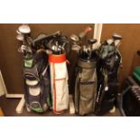 Four golf bags and collection of golf clubs including Slazenger, Dunlop, etc.