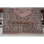 Turkish design rug with a pink ground, 2.80 by 1.67.