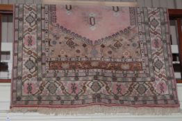 Turkish design rug with a pink ground, 2.80 by 1.67.