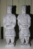 Pair of composite warrior statues, 58cm high.
