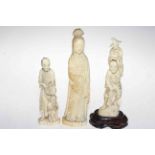 Three late 19th Century Japanese walrus ivory okimonos, tallest 25cm.