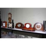 Six mantel clocks including mahogany inlaid, Art Deco style, Griffiths and Hutton.