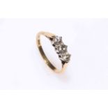 18 carat gold and platinum three stone diamond ring, size P.