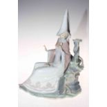 Lladro figure of elegant lady seated by ancient wall and with roses on her lap, 38cm.