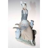 Lladro figure of Dutch girl with milk churns and barrow, 32cm.