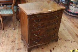 Mahogany serpentine front chest having brush slide above four long drawers on bracket feet,