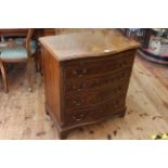 Mahogany serpentine front chest having brush slide above four long drawers on bracket feet,