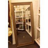 Gilt framed rectangular wall mirror, 171cm by 80cm overall.
