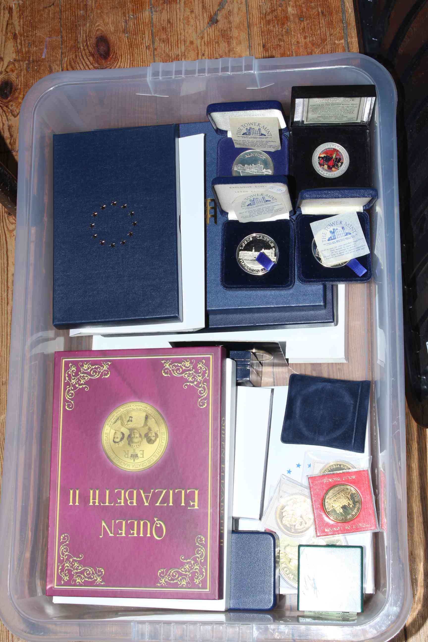 Large assortment of gold plated coins including Piedfort, cased commemorative medallions,