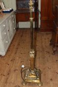 Reeded brass telescopic standard lamp.