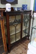 Early 20th Century mahogany two door china cabinet on ball and claw feet,