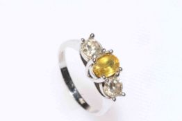 18 carat white gold three stone diamond and citrine ring, size P/Q.