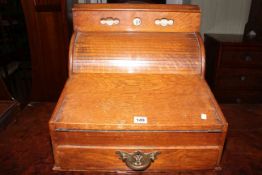 Oak tambour front table desk calendar fitted with stationery compartment and drawer,