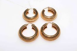 Two pair of 9 carat gold hoop earrings.