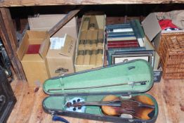 Collection of books, prints, violin in case, wicker picnic basket, fabrics, leather case, etc.