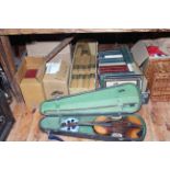 Collection of books, prints, violin in case, wicker picnic basket, fabrics, leather case, etc.