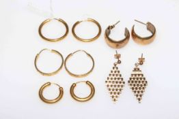 Five pair of 9 carat gold earrings.