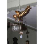 Gilt cherub light fitting, the cherub holding lustre drop fittings.