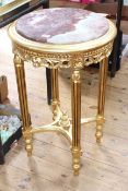 Pair circular gilt and inset marble top tables, 75cm high by 48cm diameter.