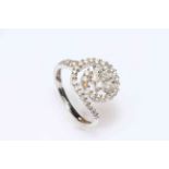 9 carat gold diamond multi-stone swirl set ring, size O.