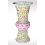 Large Chinese vase with decoration on yellow ground and pink leaf moulded bulbous centre, 49cm.