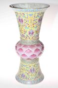 Large Chinese vase with decoration on yellow ground and pink leaf moulded bulbous centre, 49cm.