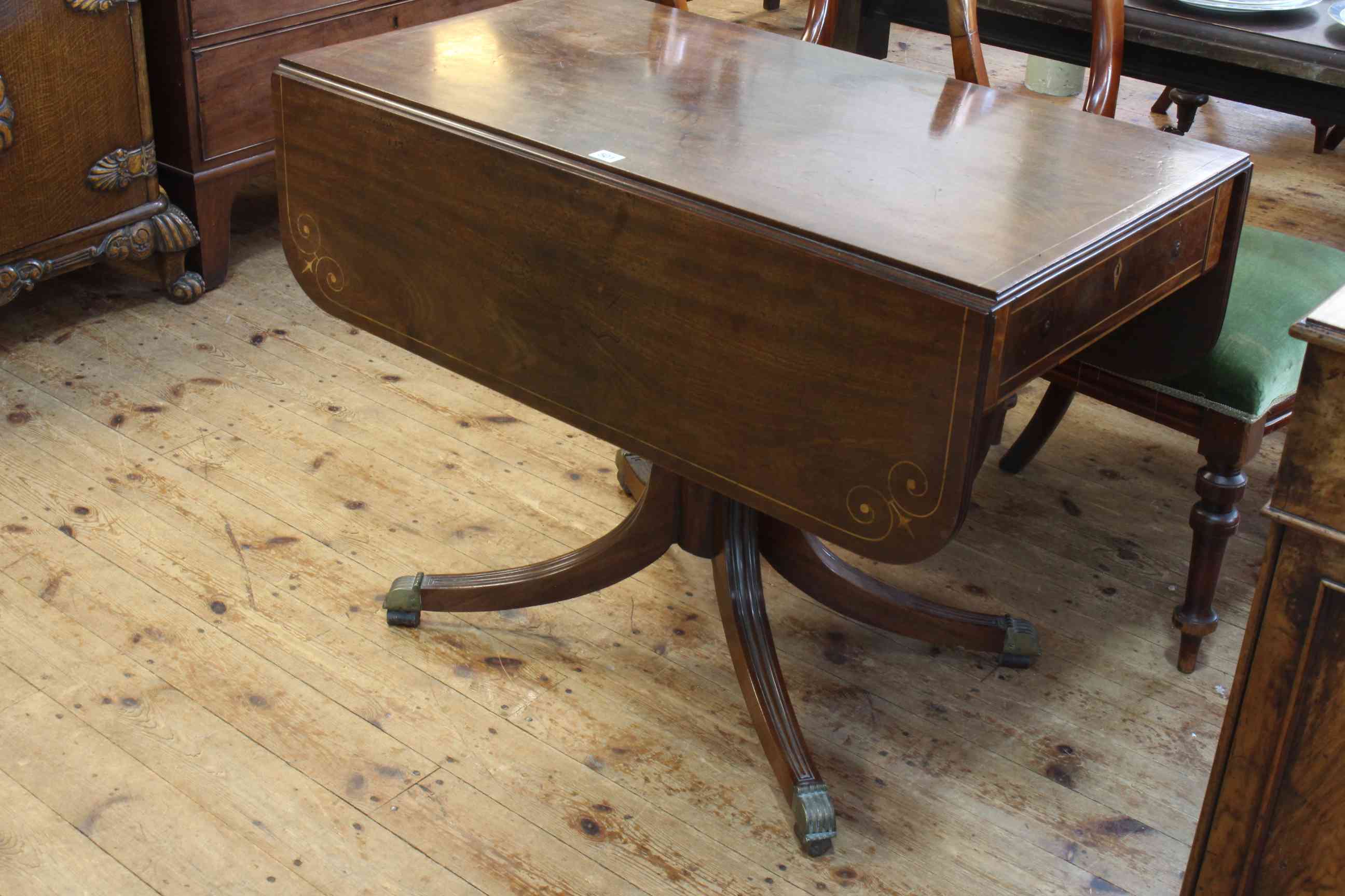 Regency inlaid mahogany Pembroke table having frieze drawer and raised on ring turned pedestal to