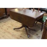 Regency inlaid mahogany Pembroke table having frieze drawer and raised on ring turned pedestal to