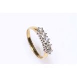 Five stone diamond ring set in 18 carat gold, size R.