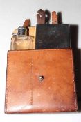 Equestrian leather belt pouch fitted with bottle and double hinged provision box.