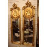 Pair large arched top gilt framed rectangular bevelled wall mirrors with classical maiden panels,