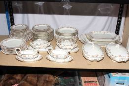 Limoges dinner service, approximately sixty pieces including tureens and dinner plates.