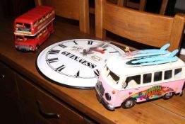 Reproduction Quartz clock and two reproduction model vehicles.