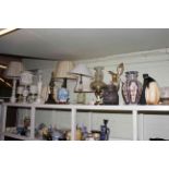 Collection of table lamps, vases, oil lamps, horse head statue, penguin ornament.